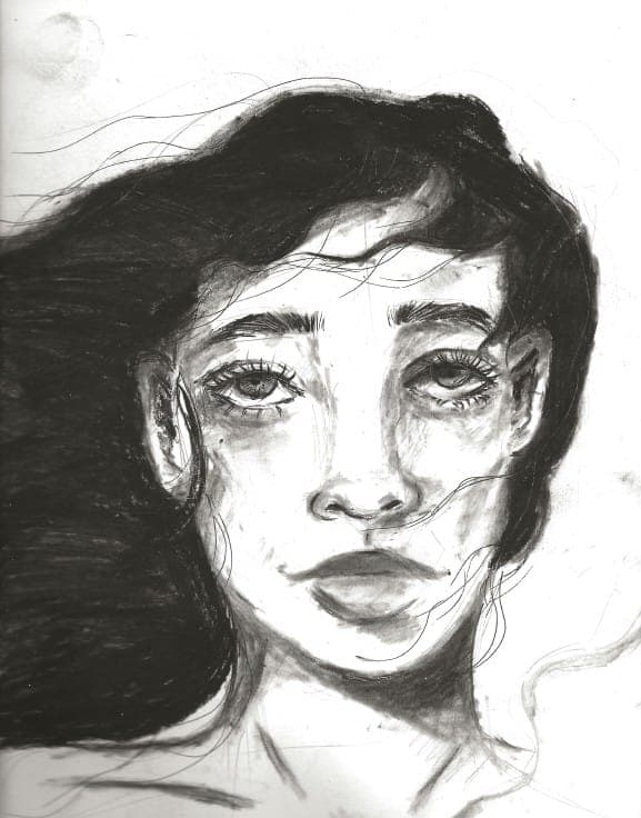 Charcoal portrait of a young woman with loose, dark hair
